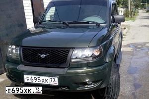 Фото автомобиля UAZ 3163 PATRIOT, 2010 — госномер Е695ХК73. Цвет: золотистый лист металлик