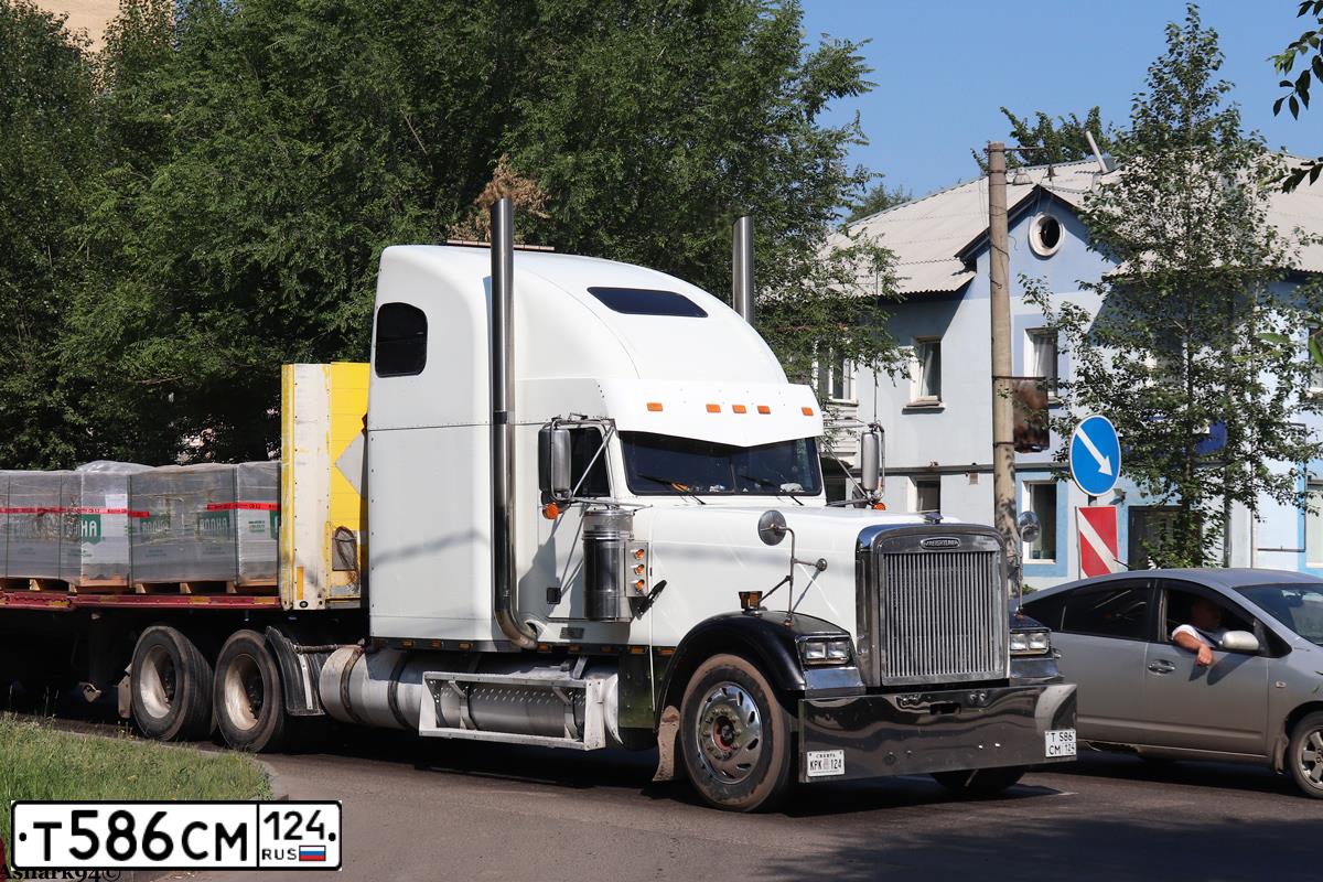 Фото автомобиля FREIGHTLINER SEVERE DUTY FLD, 2000 — госномер Е495ЕР70. Цвет: Белый