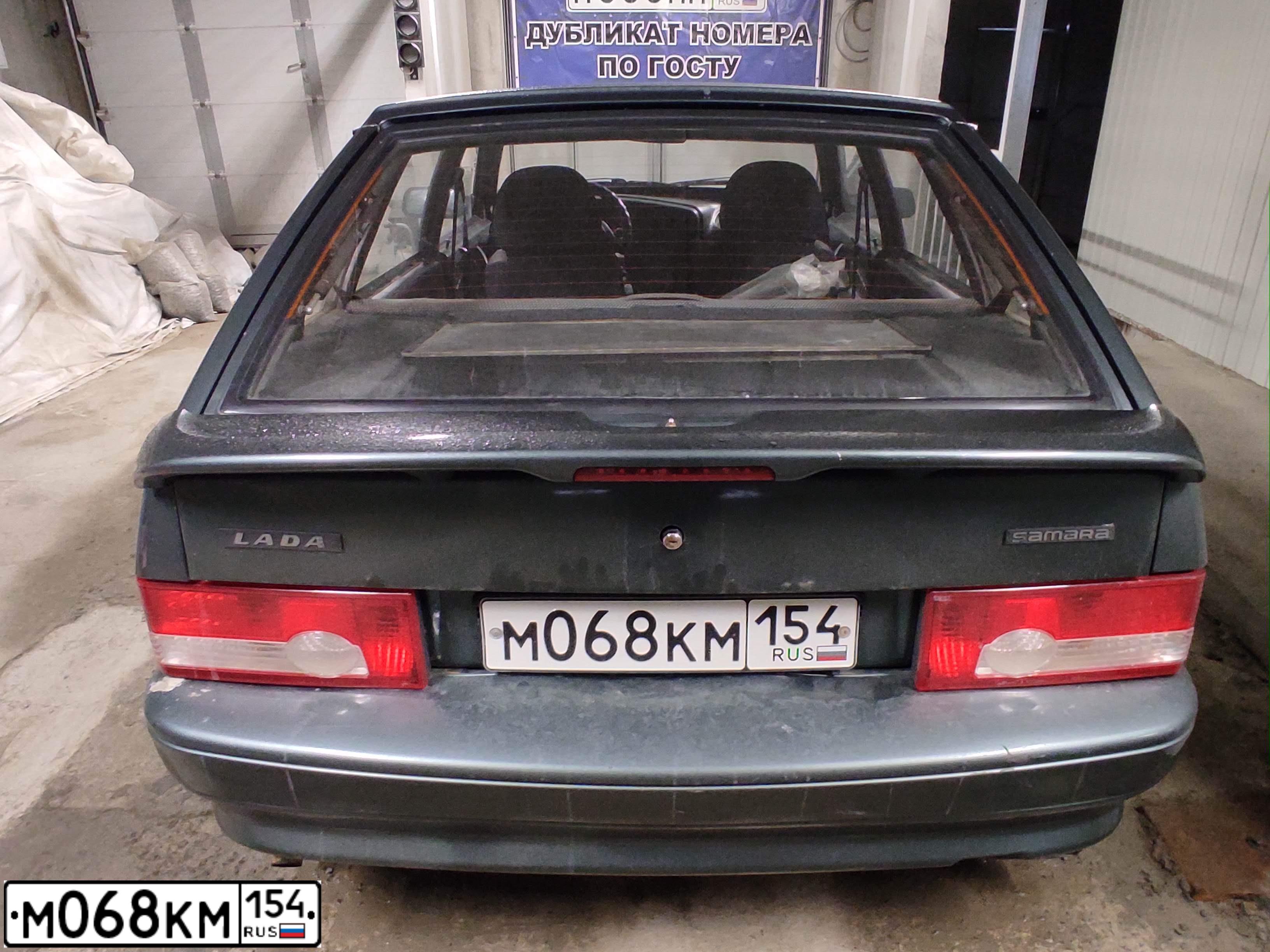 Фото автомобиля LADA 2114 SAMARA, 2010 — госномер М068КМ154. Цвет: Серо-сине-зеленый