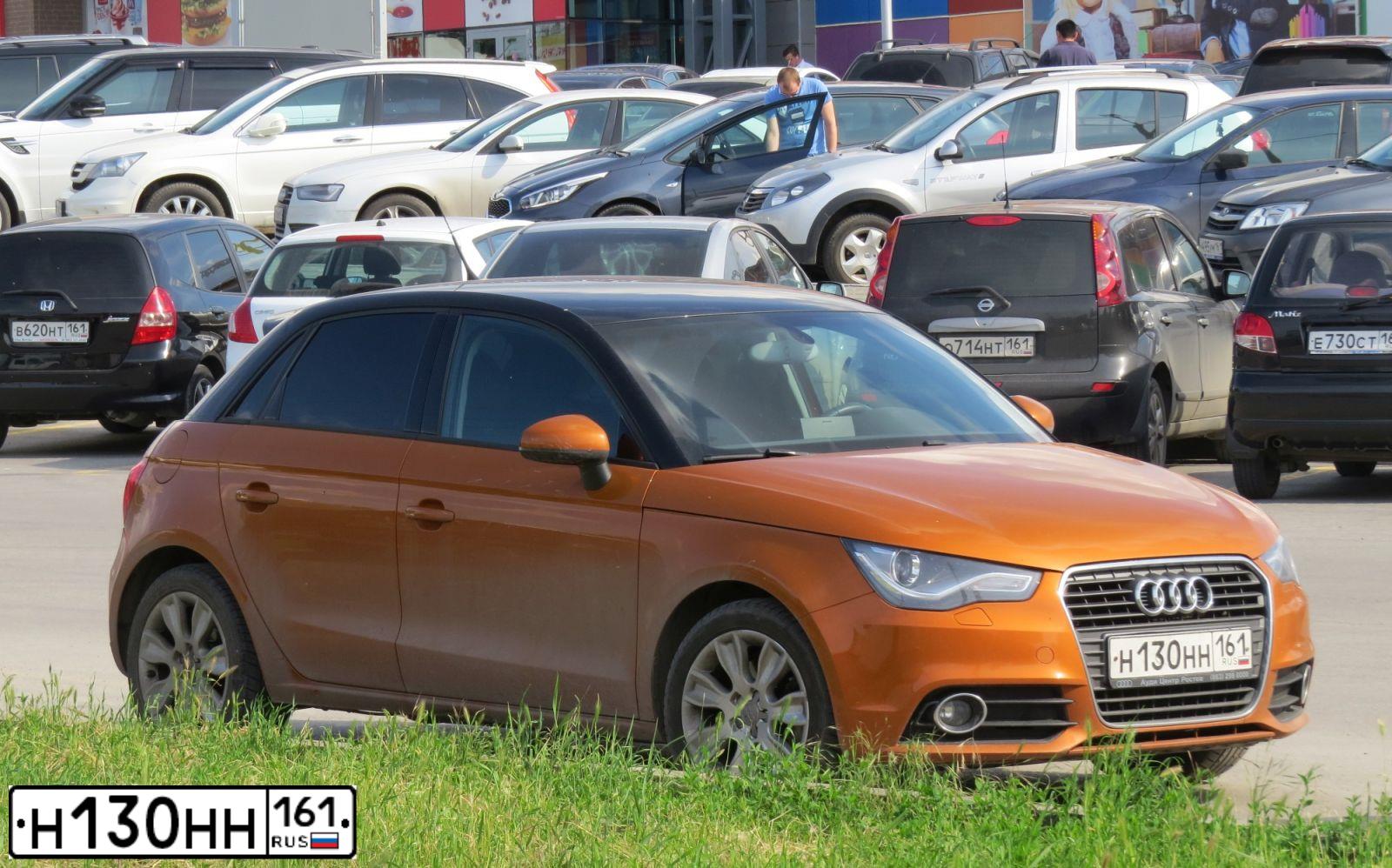 Фото автомобиля AUDI A1 SPORTBACK, 2013 — госномер Н130НН161. Цвет: Оранжевый