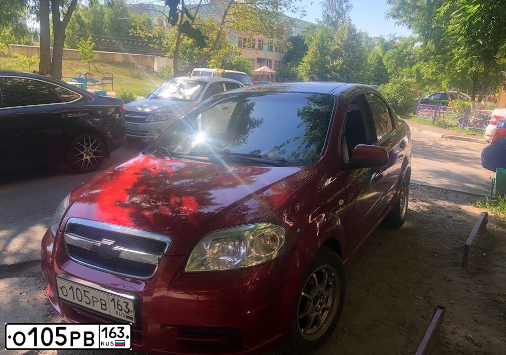 Фото автомобиля CHEVROLET AVEO, 2007 — госномер О133ХР31. Цвет: КРАСНЫЙ