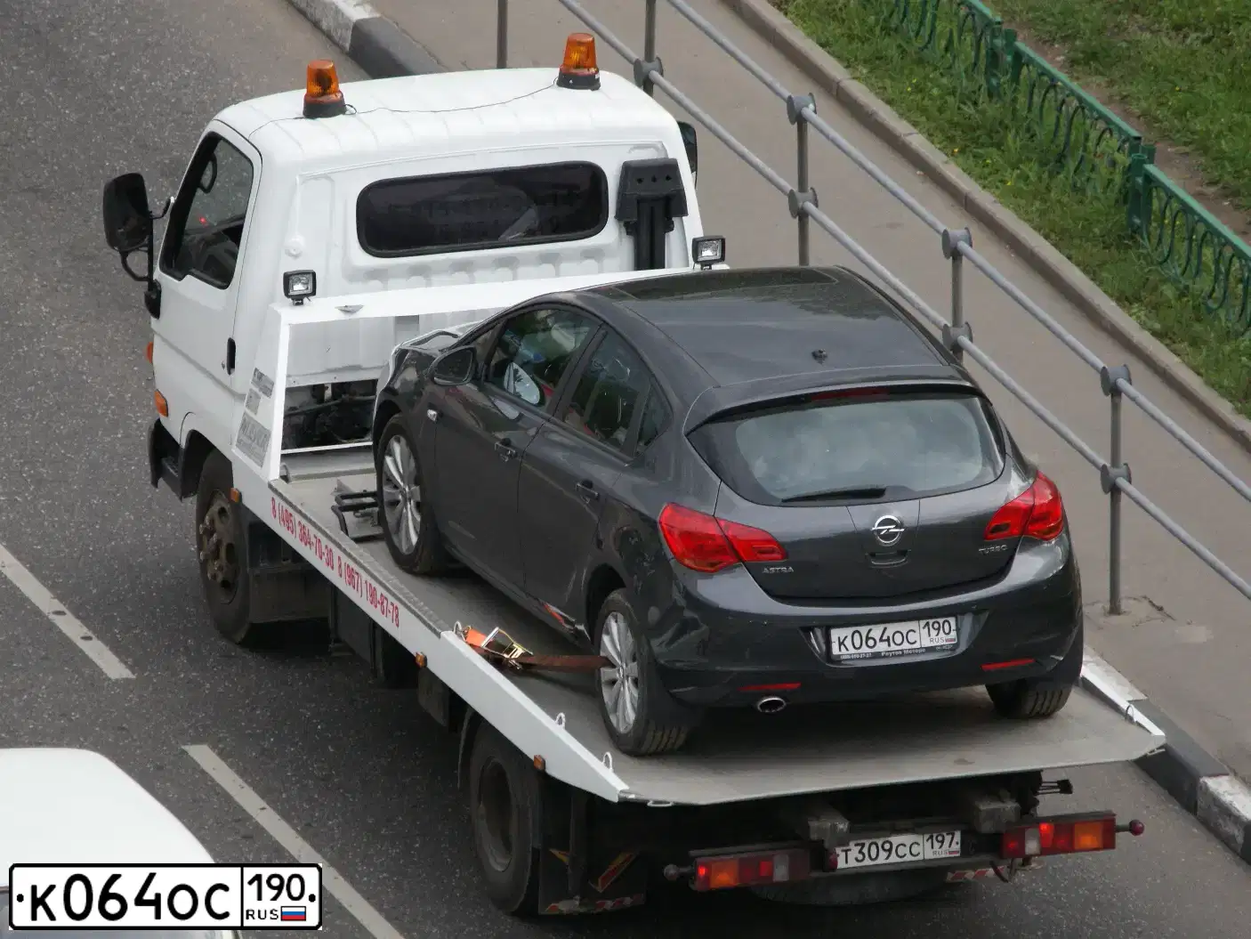 Фото автомобиля OPEL ASTRA, 2011 — госномер К064ОС190. Цвет: СЕРЫЙ ТЕМНЫЙ
