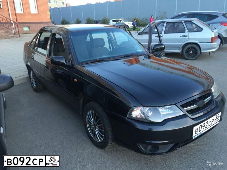 Фото автомобиля DAEWOO NEXIA, 2012 — госномер К035ВА35. Цвет: Бледно-Черный