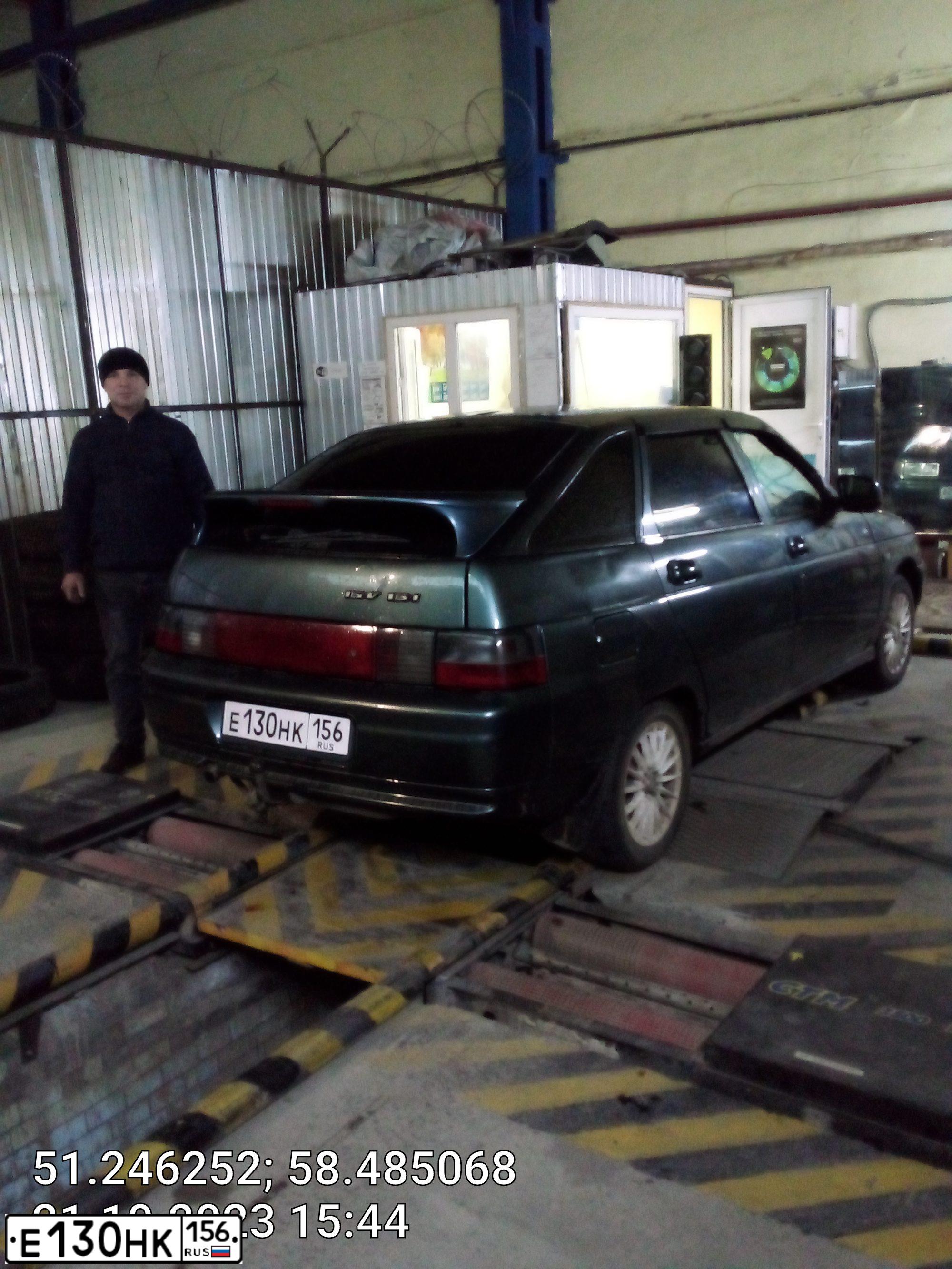 Фото автомобиля LADA 2112, 2007 — госномер Е311АУ156. Цвет: СЕРО-ЗЕЛЕНЫЙ