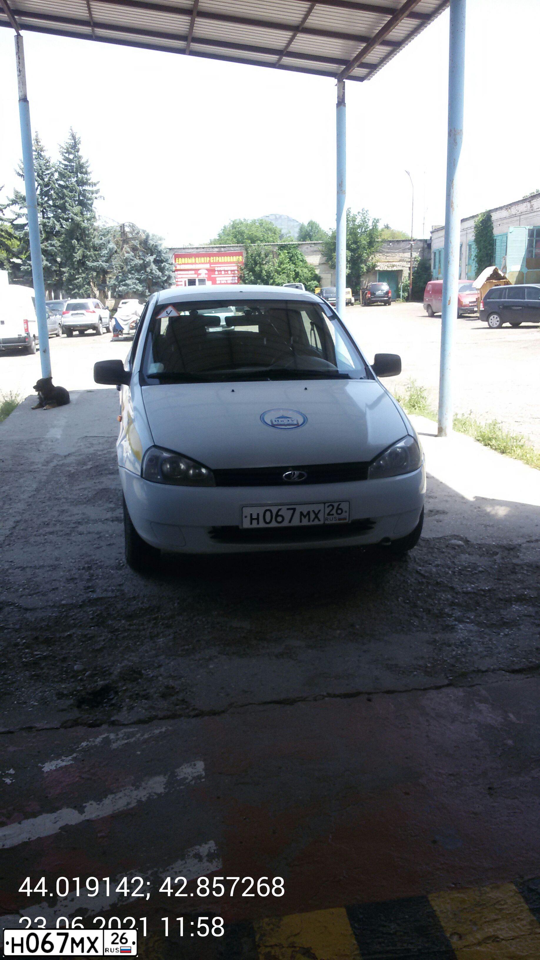 Фото автомобиля LADA 1119 KALINA, 2013 — госномер Н067МХ26. Цвет: Белый