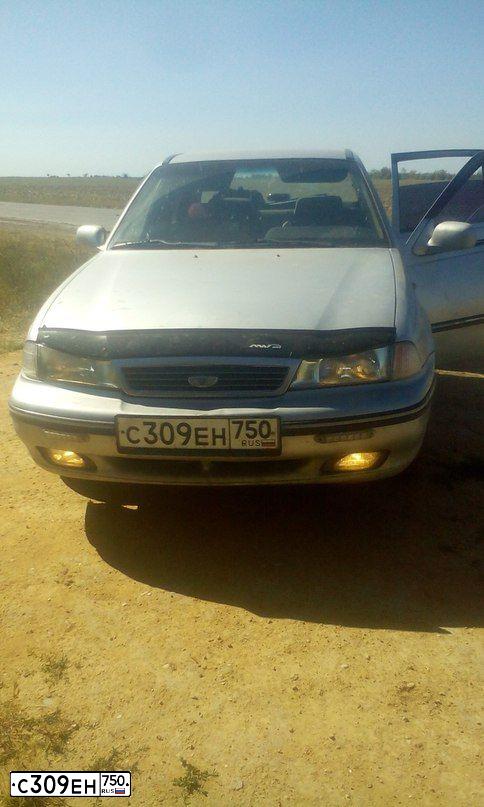 Фото автомобиля DAEWOO NEXIA, 2004 — госномер К369РХ82. Цвет: СЕРЫЙ