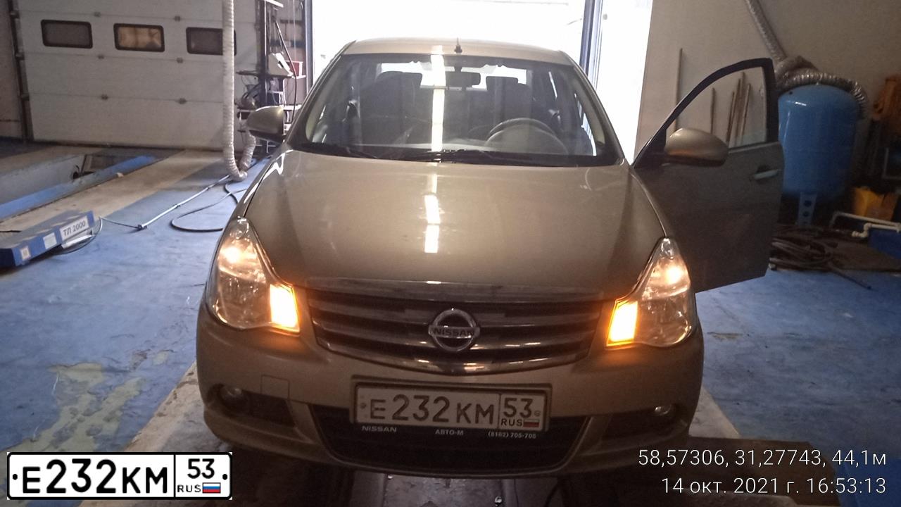 Фото автомобиля NISSAN ALMERA /AVTOVAZ/, 2016 — госномер Е232КМ53. Цвет: СЕРО-БЕЖЕВЫЙ