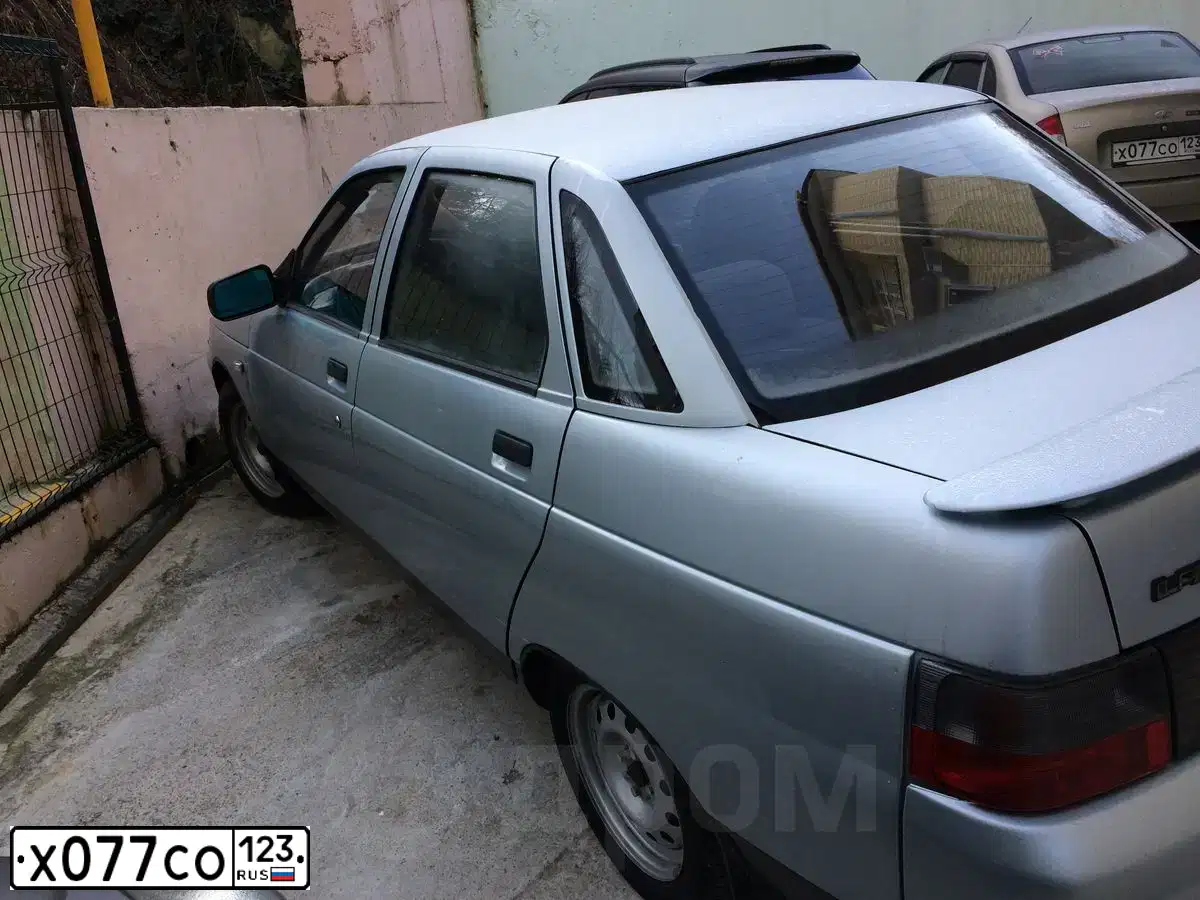 Фото автомобиля LADA 1118 KALINA, 2006 — госномер Х077СО123. Цвет: БЕЖЕВО-СЕРЫЙ