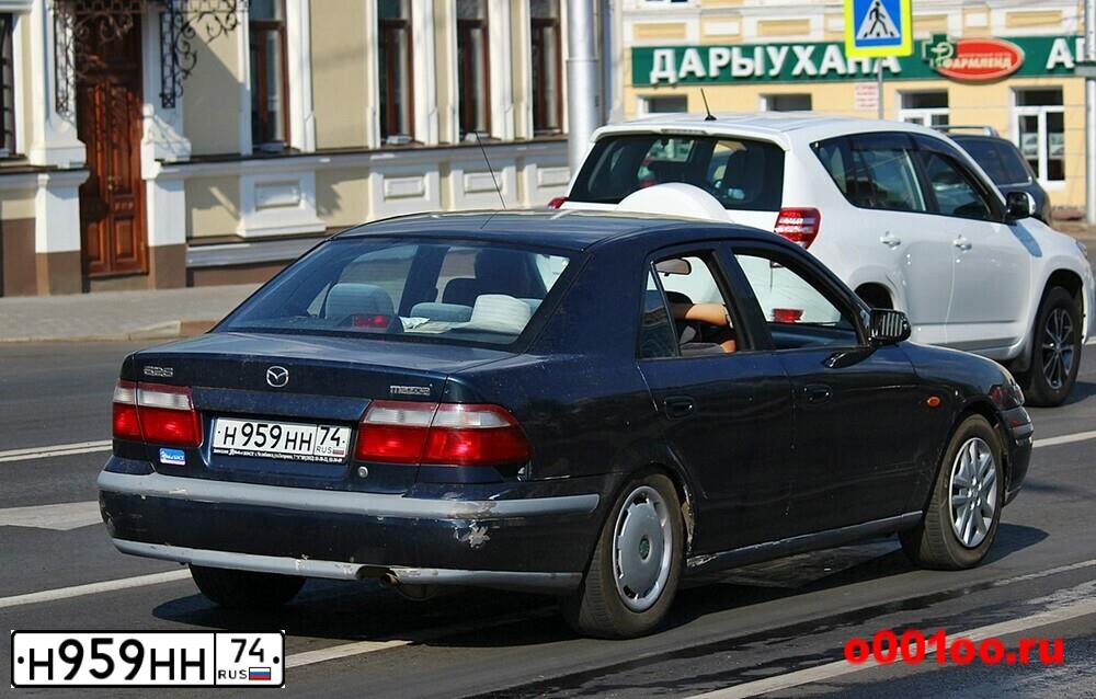Фото автомобиля MAZDA 626, 1998 — госномер Н959НН74. Цвет: Темно-синий