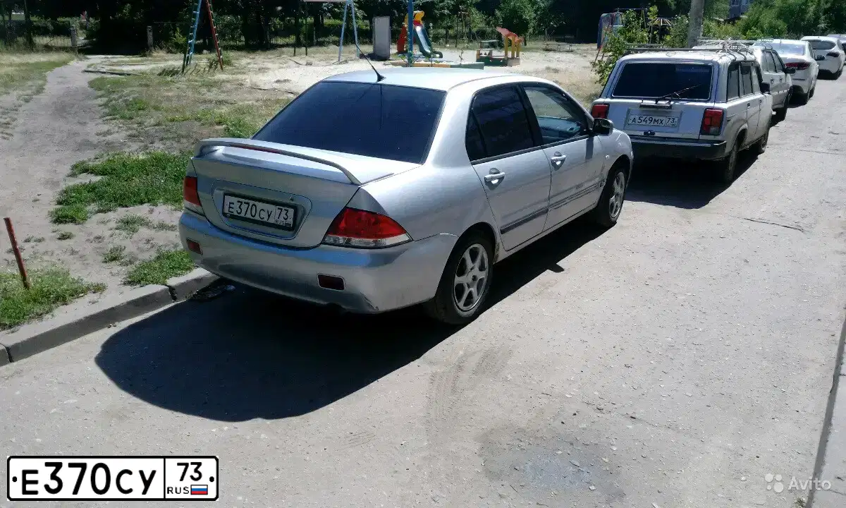 Фото автомобиля MITSUBISHI LANCER, 2003 — госномер Р080ЕС193. Цвет: СЕРЕБРИСТЫЙ