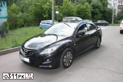 Фото автомобиля OPEL ASTRA, 2013 — госномер О311РК77. Цвет: ЧЕРНЫЙ МЕТАЛЛИК