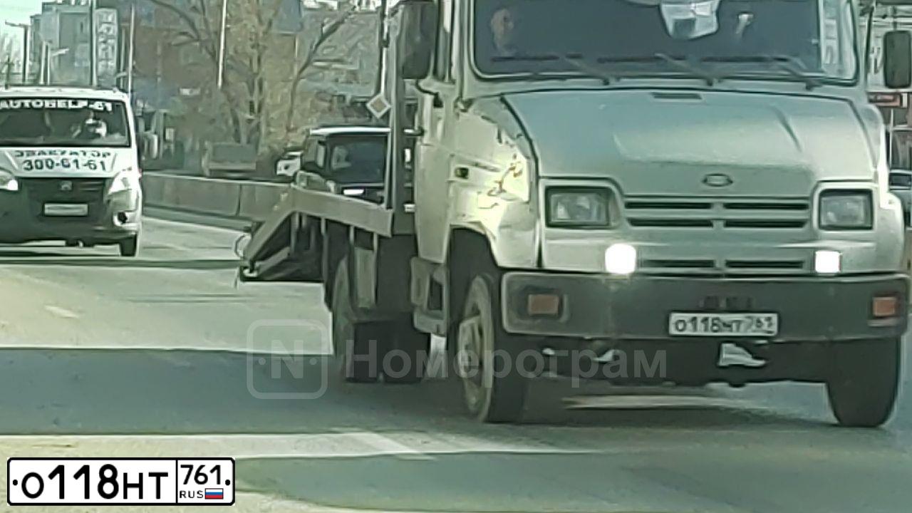 Фото автомобиля MITSUBISHI LANCER, 2007 — госномер О118НТ761. Цвет: ЧЕРНЫЙ