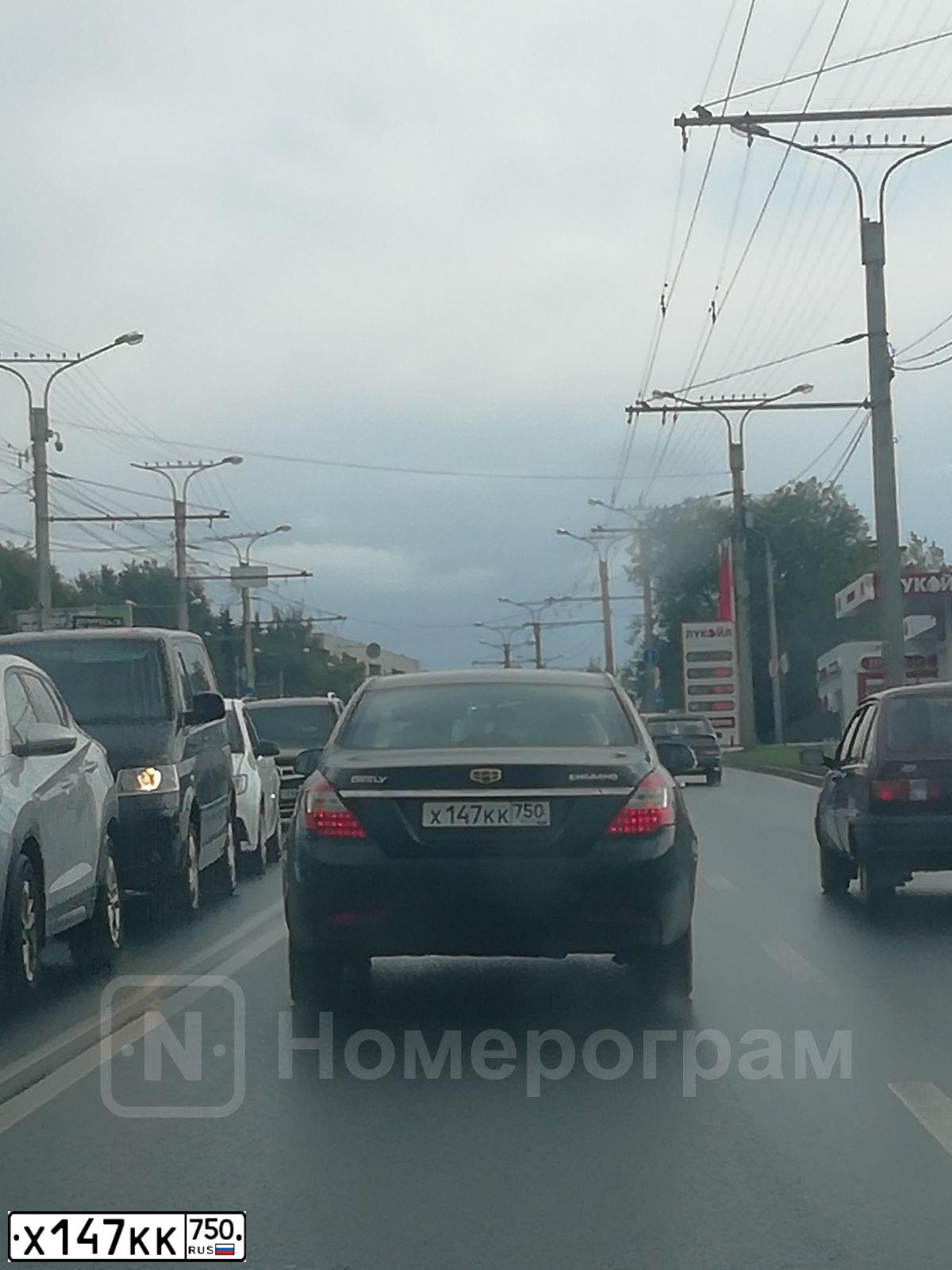 Фото автомобиля GEELY Y EMGRAND, 2014 — госномер Х147КК750. Цвет: ЧЕРНЫЙ