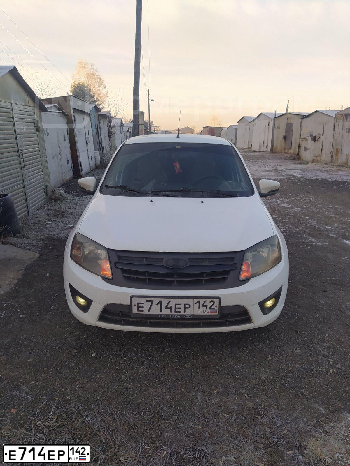 Фото автомобиля LADA 2190 GRANTA, 2015 — госномер Е714ЕР142. Цвет: БЕЛЫЙ