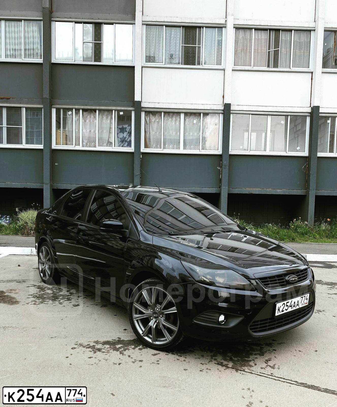 Фото автомобиля FORD FOCUS, 2009 — госномер К254АА774. Цвет: ЧЕРНЫЙ