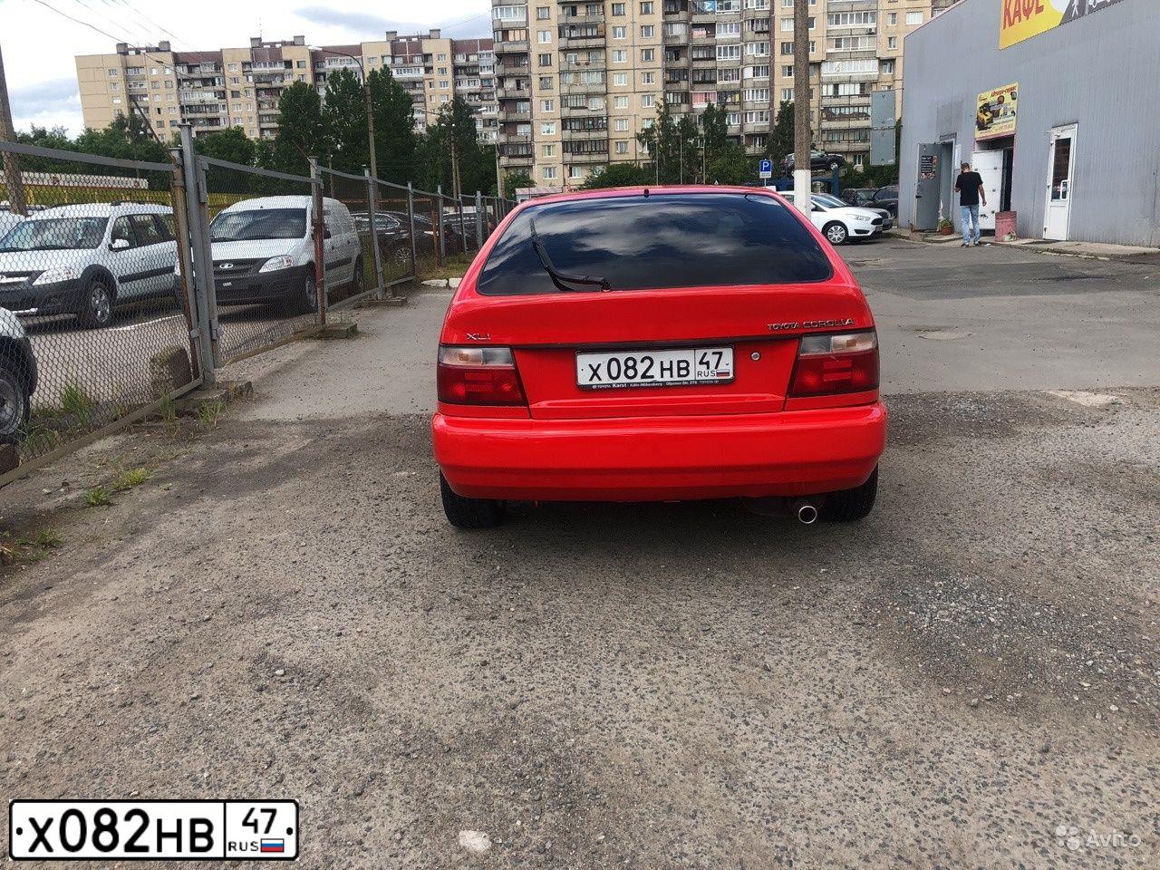 Фото автомобиля TOYOTA COROLLA, 1996 — госномер С921ТР198. Цвет: Красный