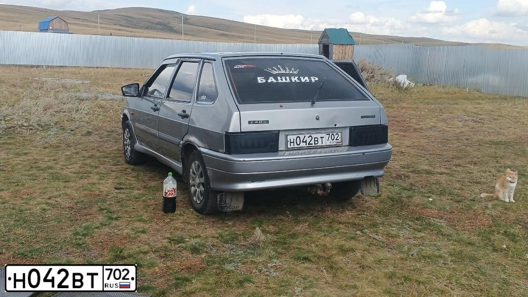 Фото автомобиля LADA 2114 SAMARA, 2009 — госномер Н042ВТ702. Цвет: СВЕТЛО-ГОЛУБОЙ