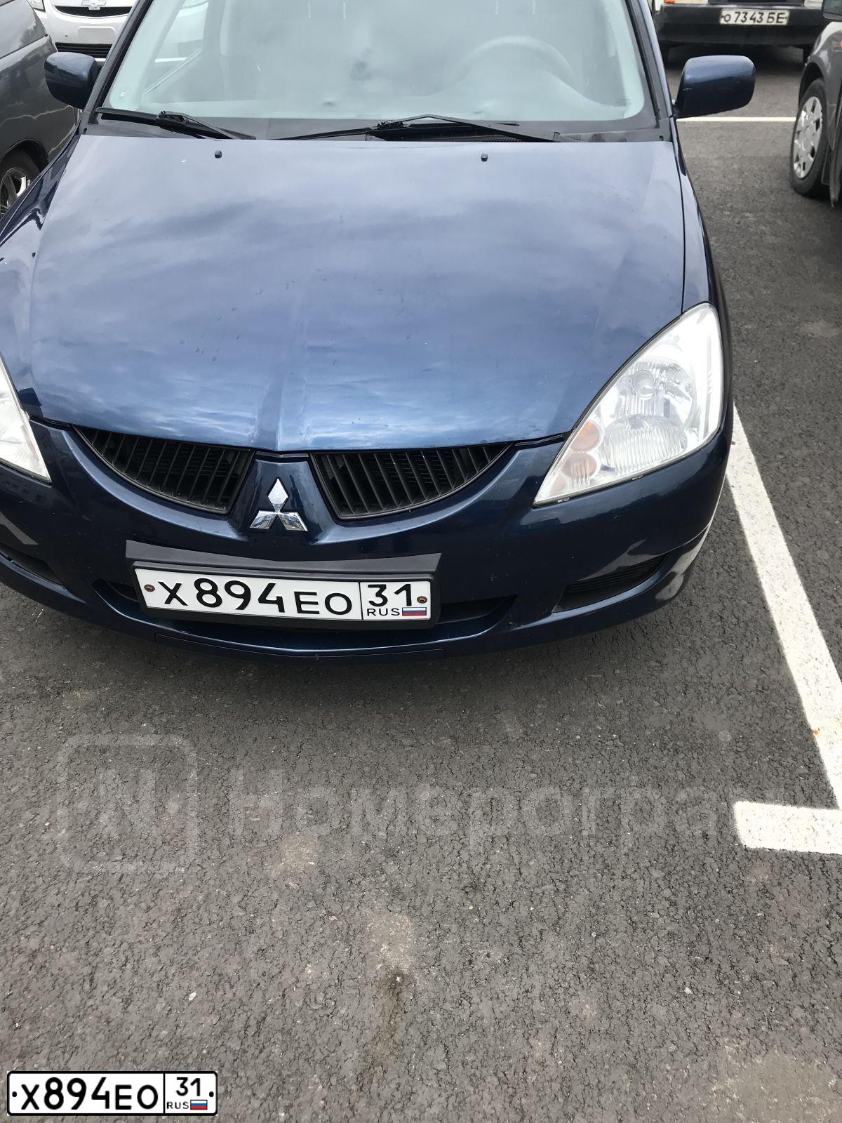 Фото автомобиля MITSUBISHI LANCER, 2004 — госномер Х894ЕО31. Цвет: синий