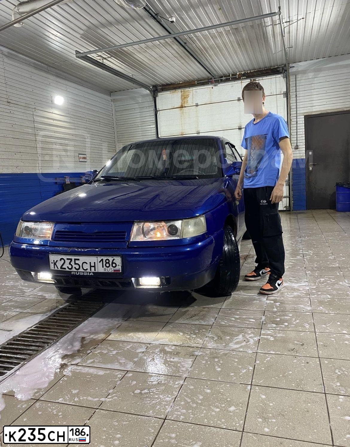 Фото автомобиля LADA 2112 LADA, 2007 — госномер К235СН186. Цвет: Серебристо-темно-синий
