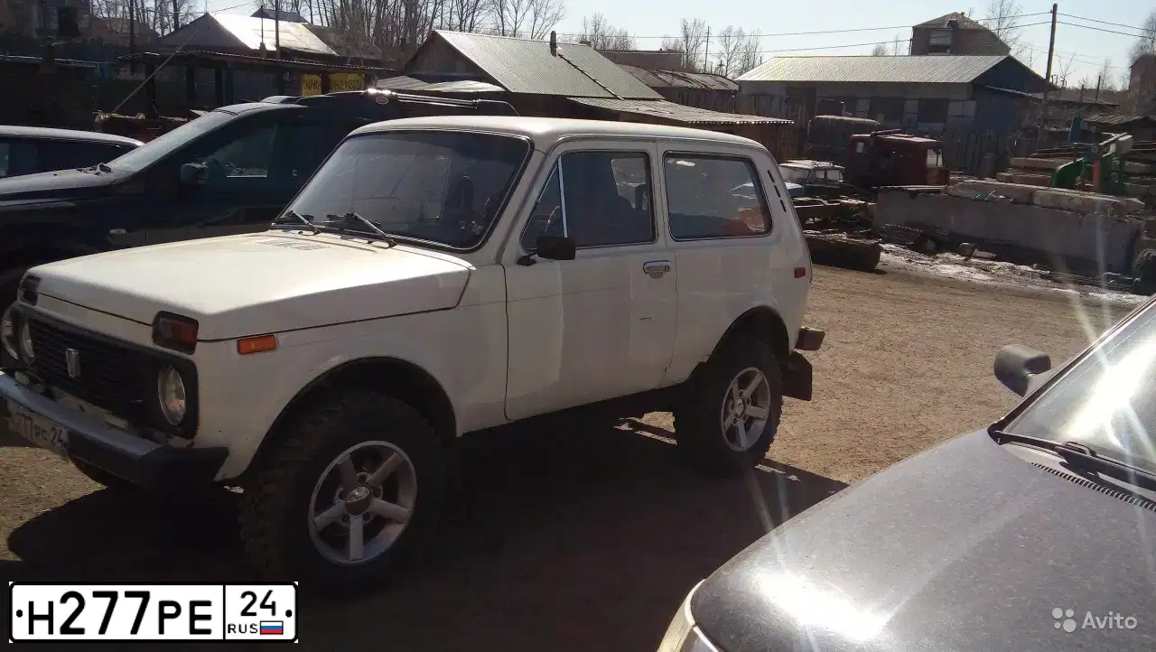 Фото автомобиля LADA 2121 NIVA, 1991 — госномер Н801ЕТ24. Цвет: БЕЛЫЙ