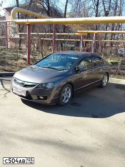 Фото автомобиля HONDA CIVIC, 2011 — госномер А745ХО01. Цвет: СЕРО-КОРИЧНЕВЫЙ