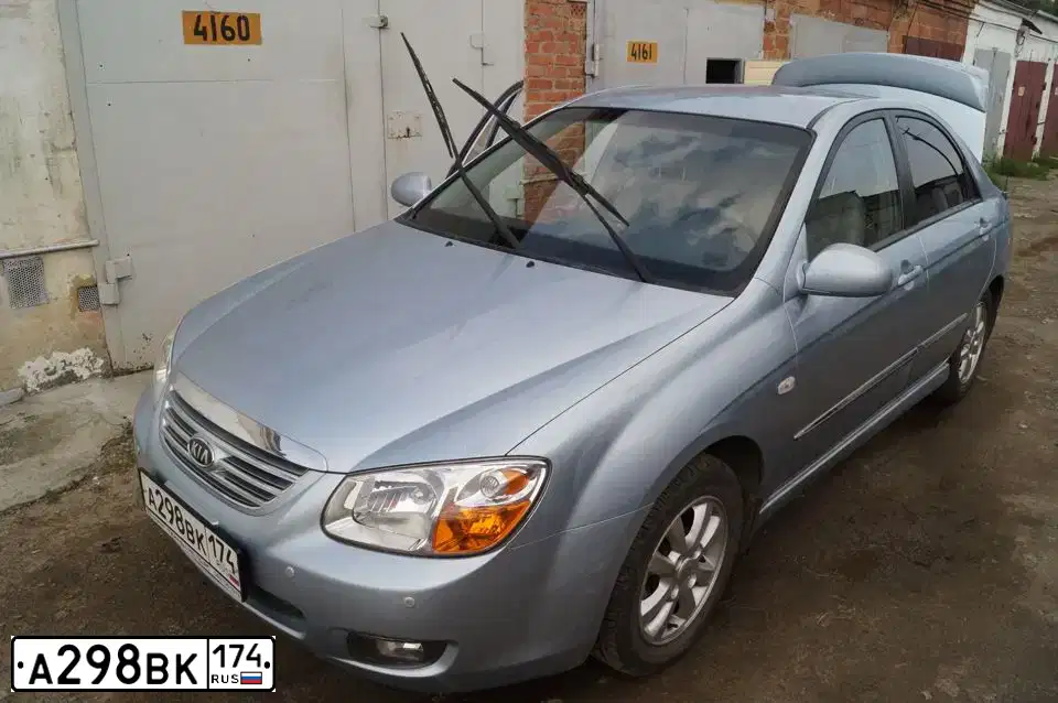 Фото автомобиля KIA CERATO, 2007 — госномер А298ВК174. Цвет: СВЕТЛО-СЕРО-ГОЛУБОЙ