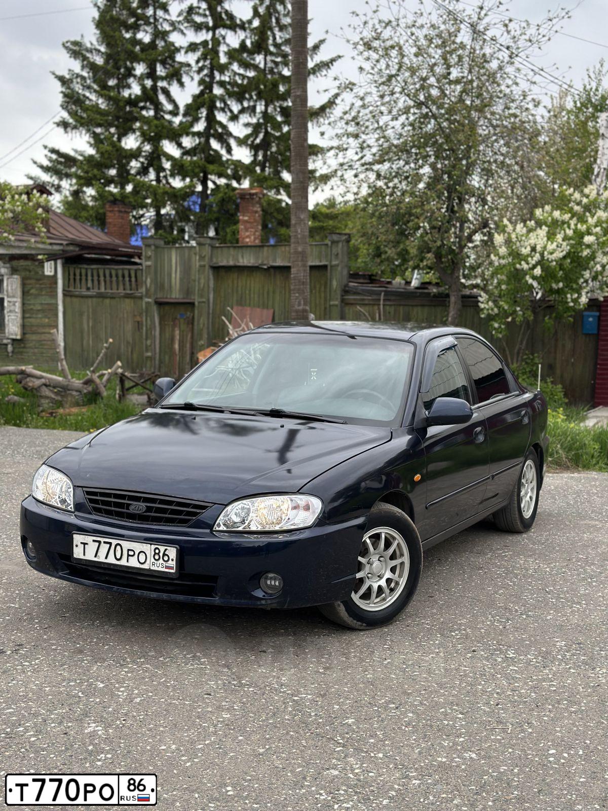 Фото автомобиля KIA SPECTRA, 2007 — госномер Т770РО86. Цвет: ТЕМНО-СИНИЙ