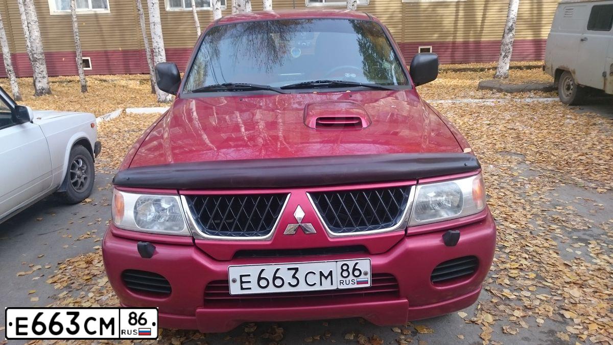 Фото автомобиля MITSUBISHI PAJERO SPORT, 2007 — госномер Е663СМ86. Цвет: Красный
