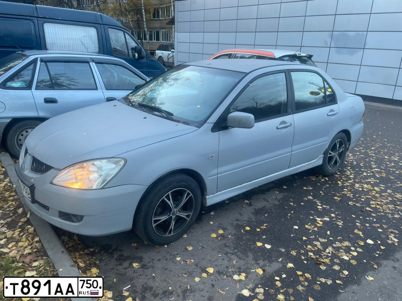 Фото автомобиля MITSUBISHI LANCER, 2004 — госномер Т891АА750. Цвет: БЕЛЫЙ