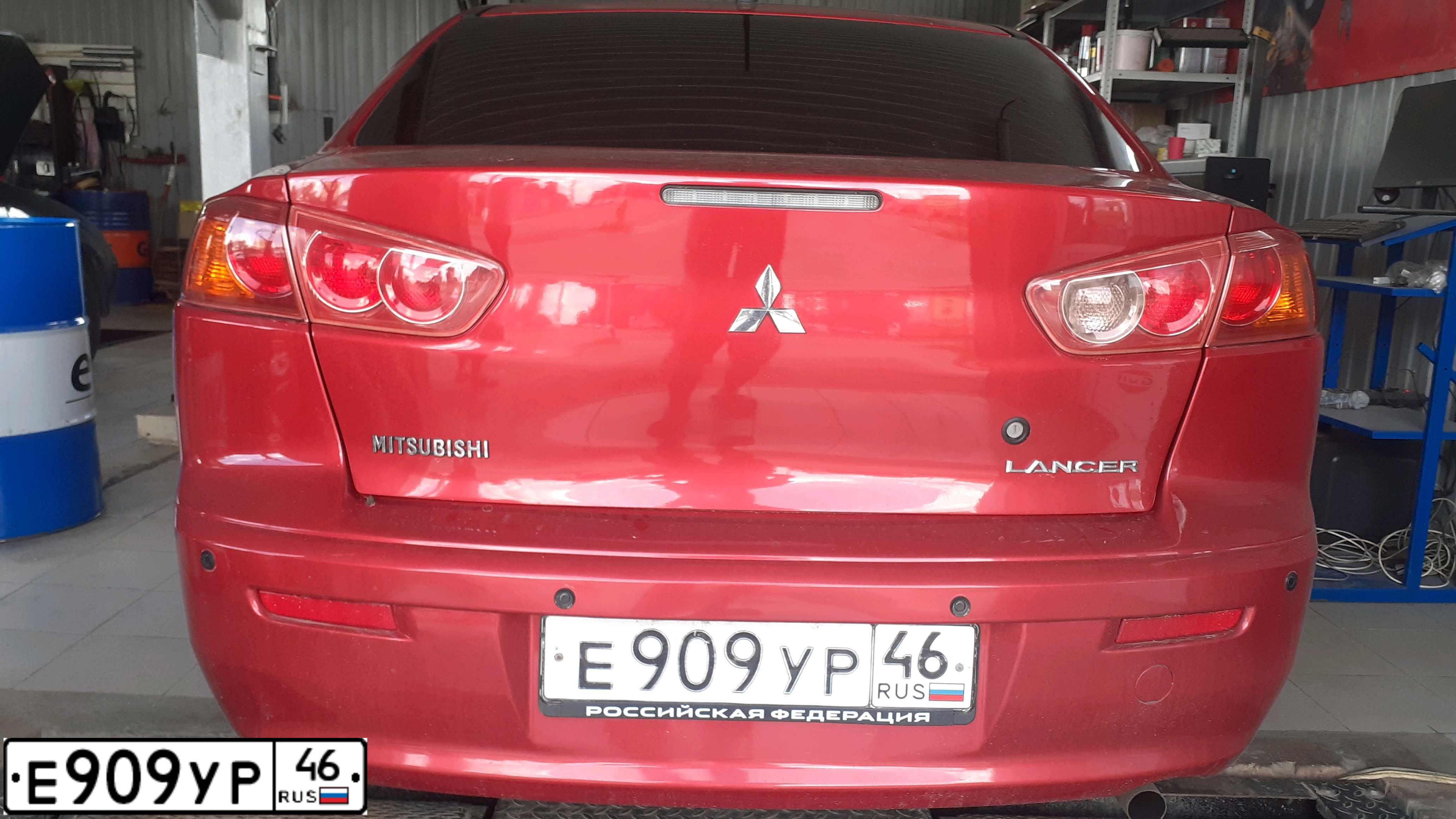 Фото автомобиля MITSUBISHI LANCER, 2007 — госномер Е909УР46. Цвет: КРАСНЫЙ