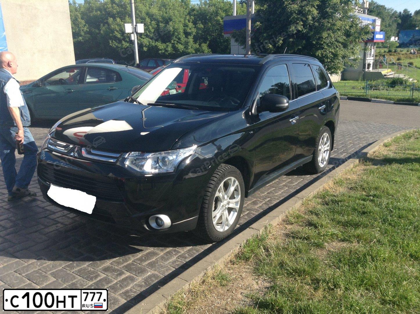 Фото автомобиля MITSUBISHI OUTLANDER, 2013 — госномер С100НТ777. Цвет: ЧЕРНЫЙ
