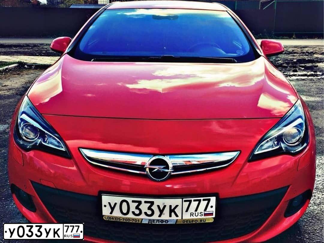 Фото автомобиля OPEL ASTRA, 2012 — госномер У033УК777. Цвет: Красный