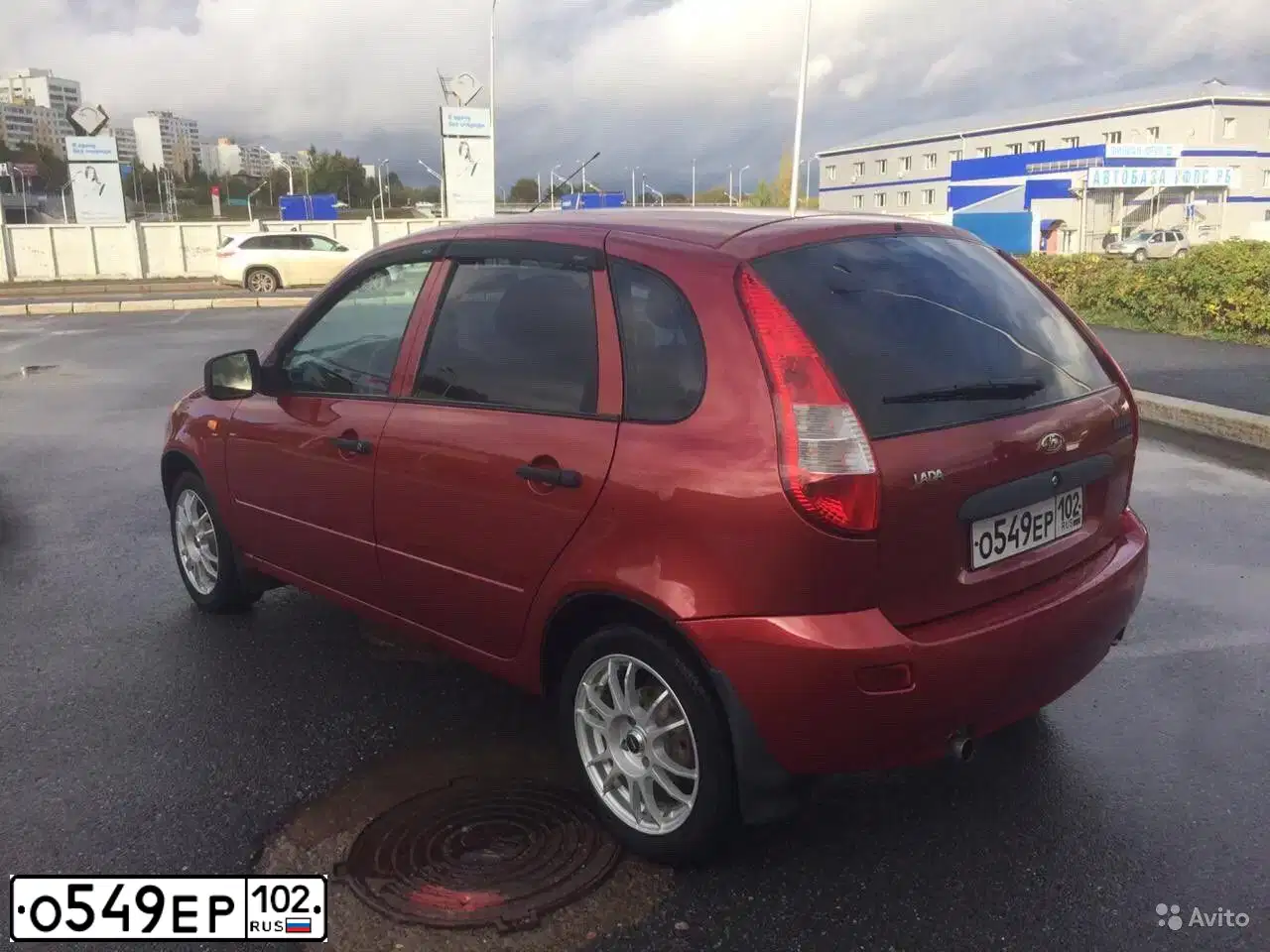 Фото автомобиля LADA 1119 KALINA, 2012 — госномер Е376РС702. Цвет: СЕРЕБРИСТО-КРАСНЫЙ