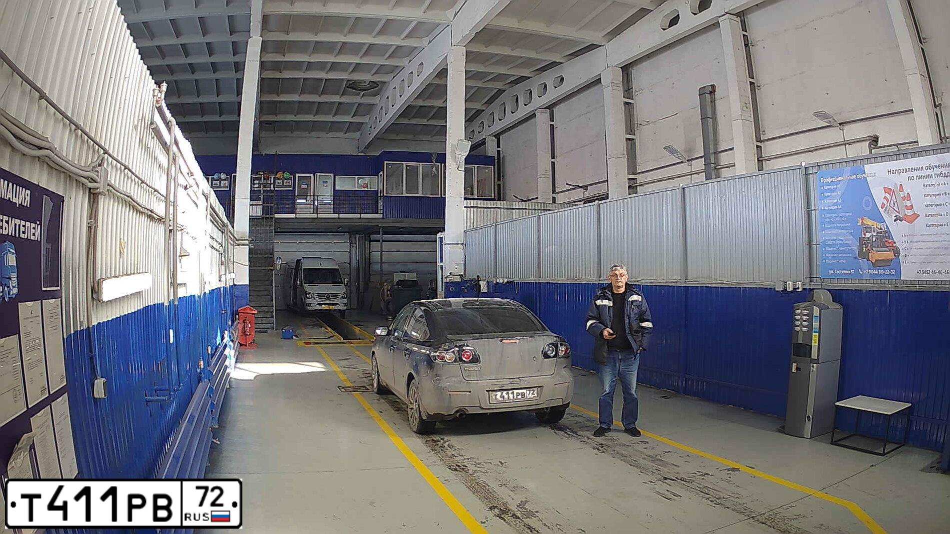 Фото автомобиля MAZDA 3, 2007 — госномер Т411РВ72. Цвет: ЧЕРНЫЙ