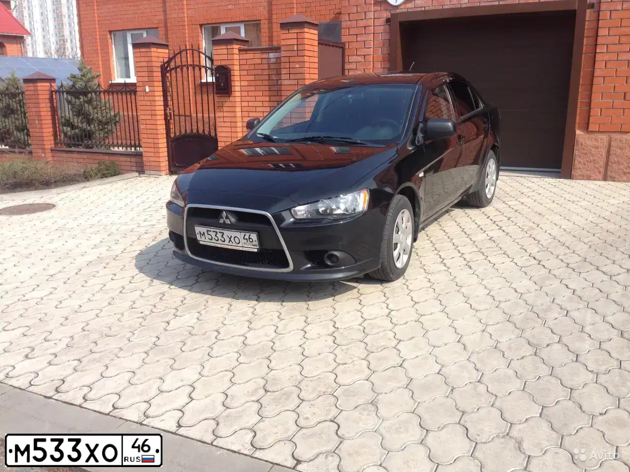 Фото автомобиля MITSUBISHI LANCER, 2012 — госномер К566НР136. Цвет: ЧЕРНЫЙ