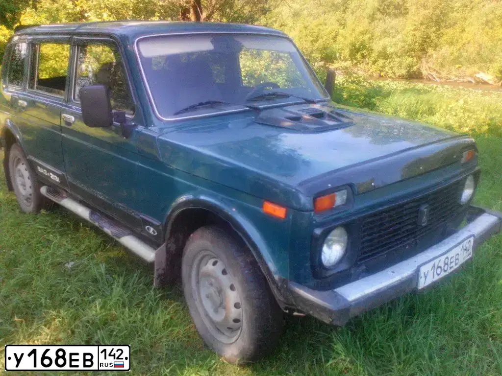 Фото автомобиля LADA 2131 NIVA, 1999 — госномер Т352КУ19. Цвет: сине-зеленый