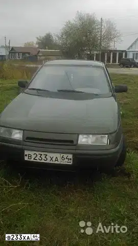 Фото автомобиля LADA 2112, 2004 — госномер В233ХА64. Цвет: ТЕМНО ЗЕЛЕНЫЙ