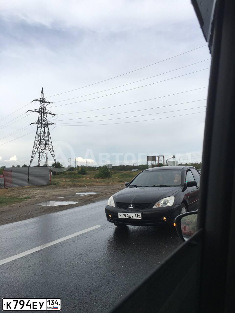 Фото автомобиля MITSUBISHI LANCER, 2007 — госномер К794ЕУ134. Цвет: ЧЕРНЫЙ