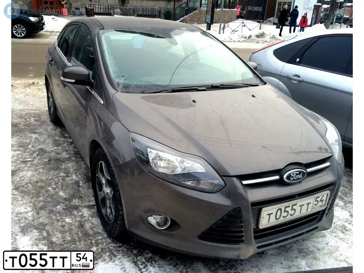 Фото автомобиля FORD FOCUS, 2013 — госномер Т055ТТ54. Цвет: СЕРО-КОРИЧНЕВЫЙ