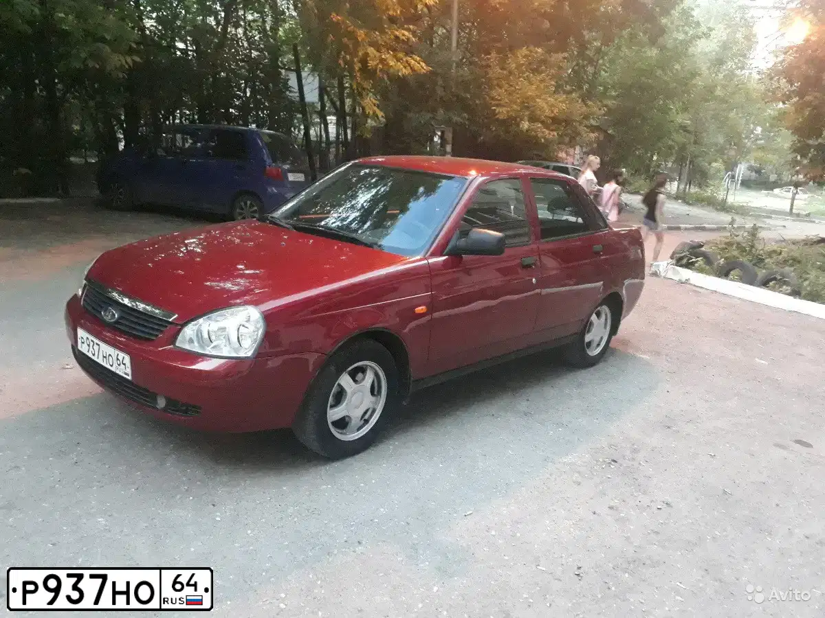 Фото автомобиля ВАЗ 217030 LADA PRIORA, 2009 — госномер Н873АК181. Цвет: ЗОЛОТИСТО-КРАСНЫЙ