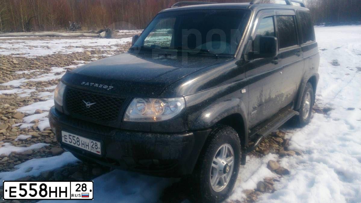 Фото автомобиля UAZ Z 3163 PATRIOT, 2012 — госномер Е558НН28. Цвет: АВАНТЮРИН МЕТАЛЛИК