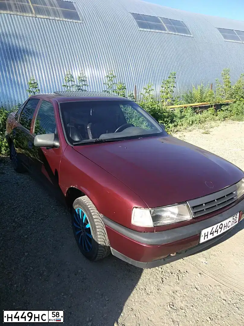 Фото автомобиля OPEL VECTRA, 1991 — госномер Н449НС58. Цвет: Красный (вишневый)