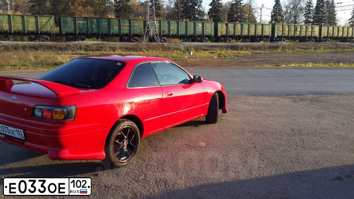 Фото автомобиля LADA 2112, 2008 — госномер Е030ОЕ102. Цвет: СЕРО-СИНЕ-ЗЕЛЕН