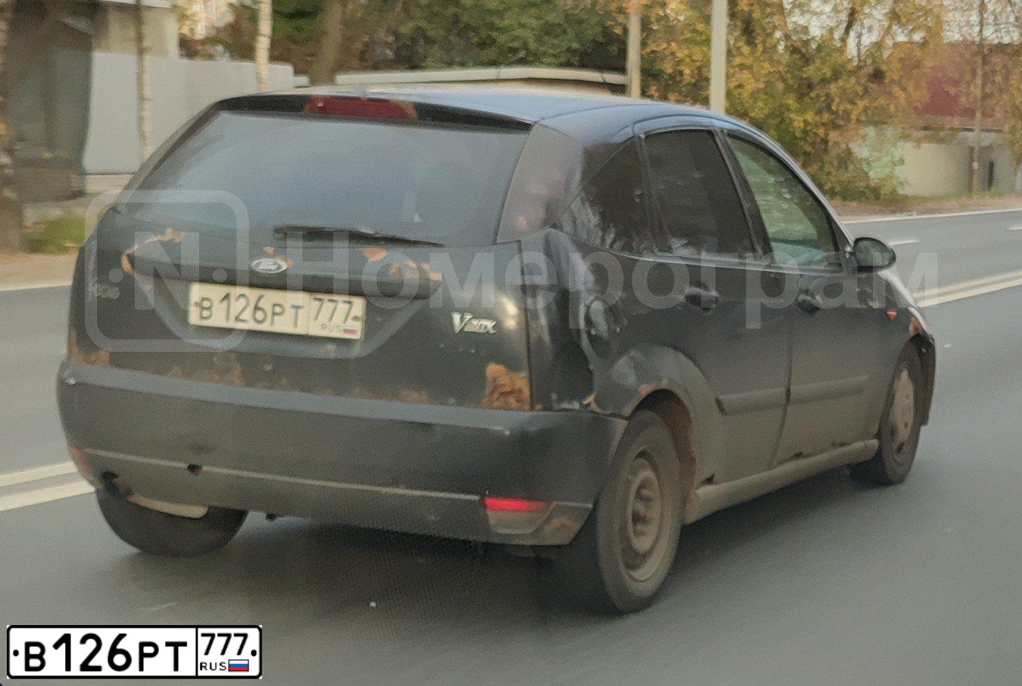 Фото автомобиля FORD FOCUS, 1999 — госномер Е097ВС199. Цвет: ЧЕРНЫЙ