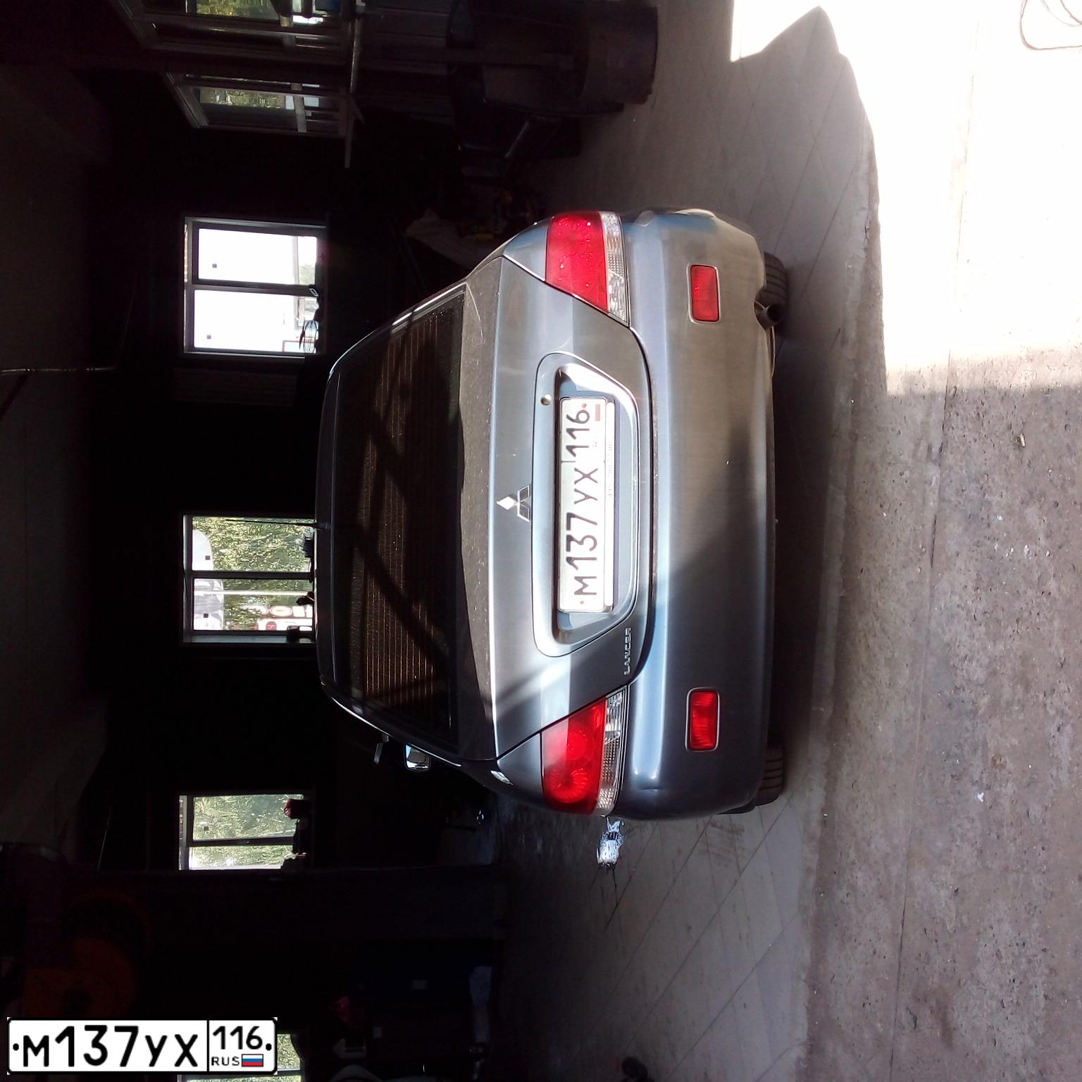 Фото автомобиля MITSUBISHI LANCER, 2009 — госномер М137УХ116. Цвет: Серый