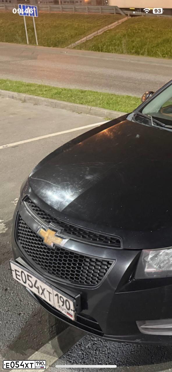 Фото автомобиля CHEVROLET CRUZE, 2012 — госномер Е054ХТ190. Цвет: ЧЕРНЫЙ