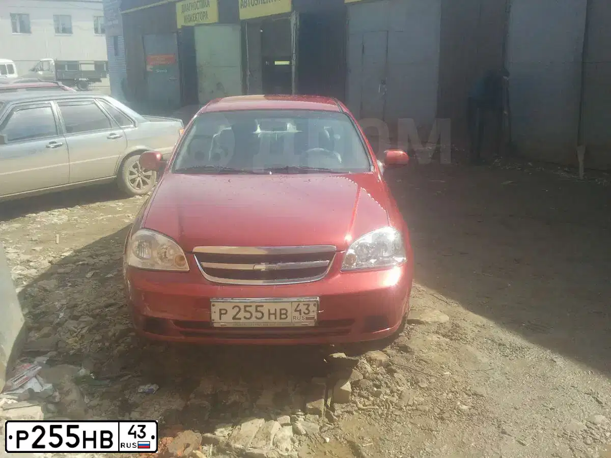 Фото автомобиля CHEVROLET LACETTI, 2005 — госномер О426ОТ43. Цвет: ТЕМНО-КРАСНЫЙ