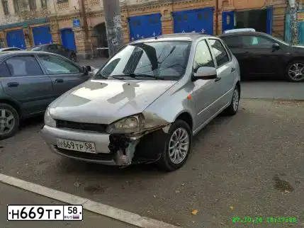 Фото автомобиля LADA 1118 KALINA, 2008 — госномер Р212НС58. Цвет: Серебристый