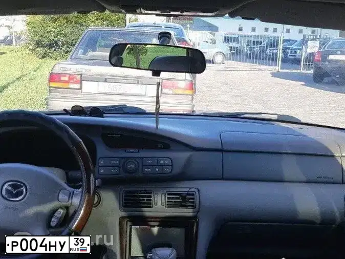 Фото автомобиля MAZDA XEDOS 6 / XEDOS 9, 1994 — госномер Р004НУ39. Цвет: ТЕМНО-ЗЕЛЕНЫЙ
