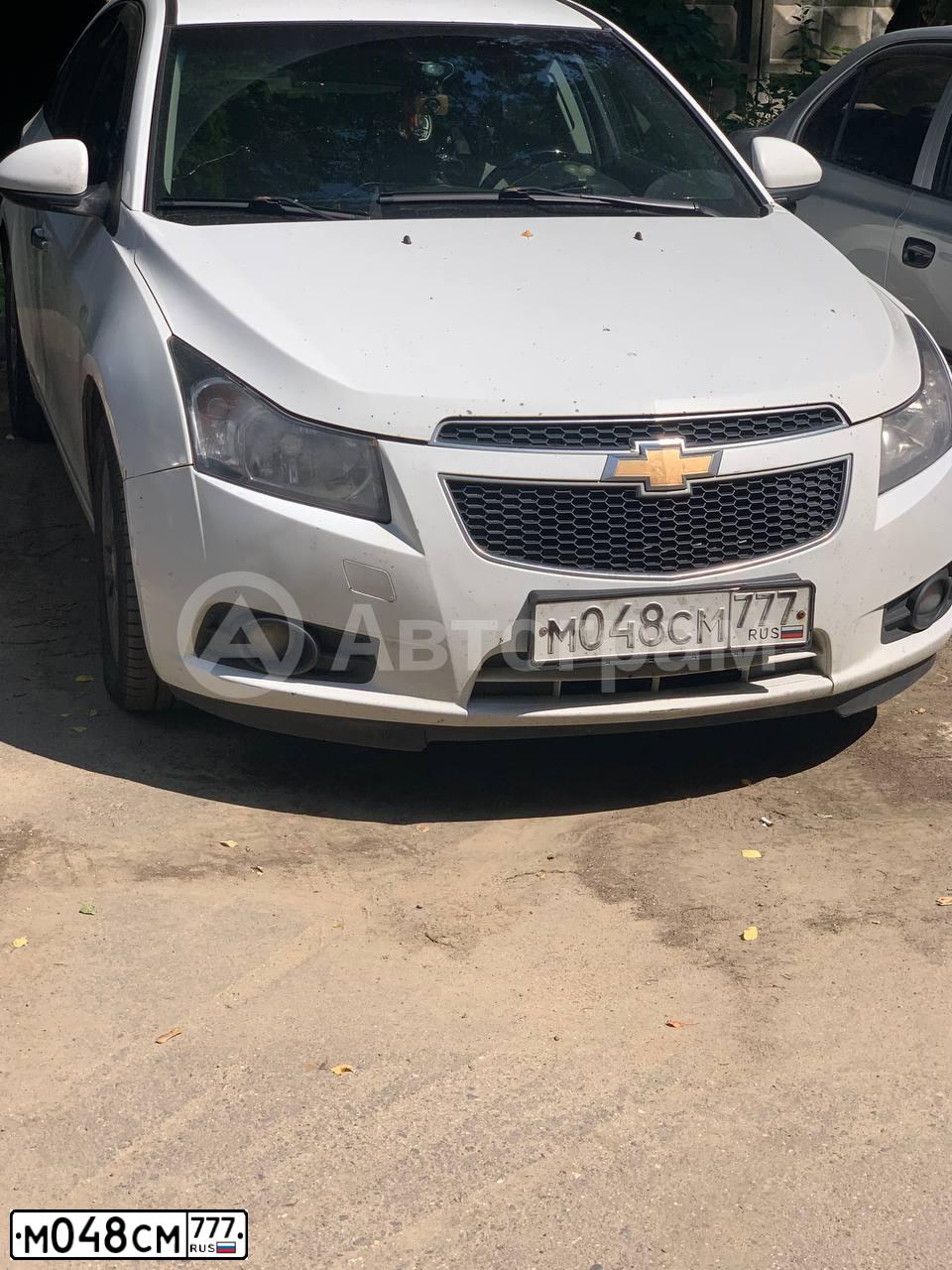 Фото автомобиля CHEVROLET CRUZE, 2012 — госномер М048СМ777. Цвет: БЕЛЫЙ